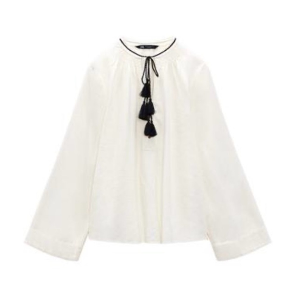 White Blouse with Black Tassels